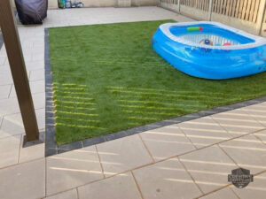 Barleystone Birch Patio with Damson Border and Artificial Grass in Naas, Co. Kildare